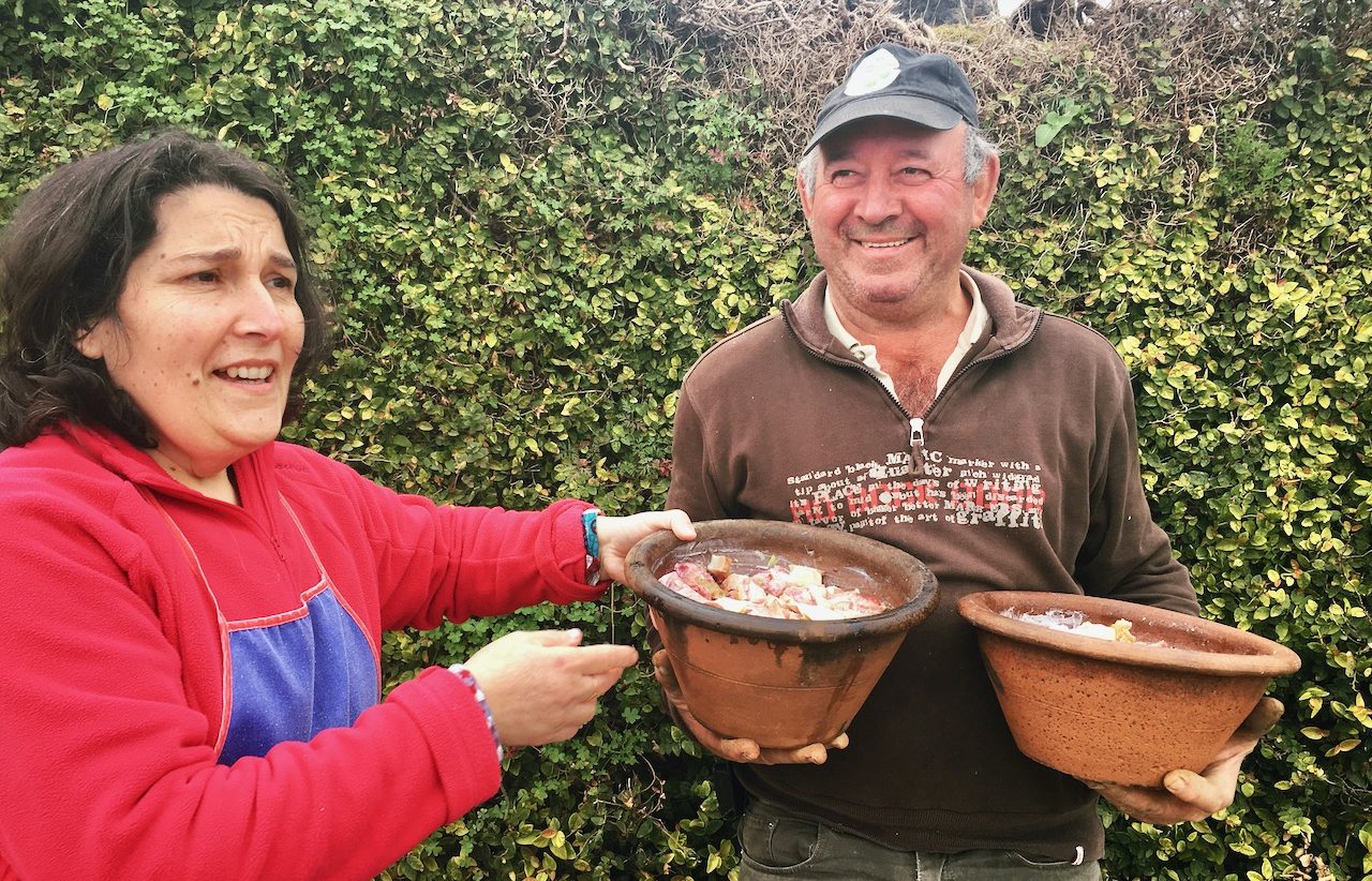 two locals from azores preparing a meal