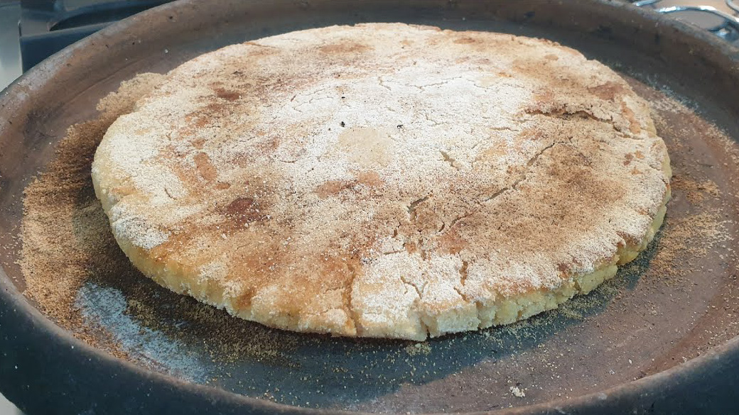 a half eaten sandwich on a pan