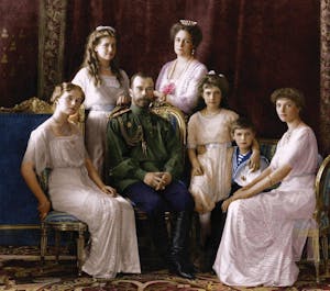 Nicholas II of Russia, Grand Duchess Anastasia Nikolaevna of Russia sitting on a bench posing for the camera