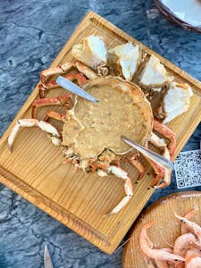 a crab on a wooden table