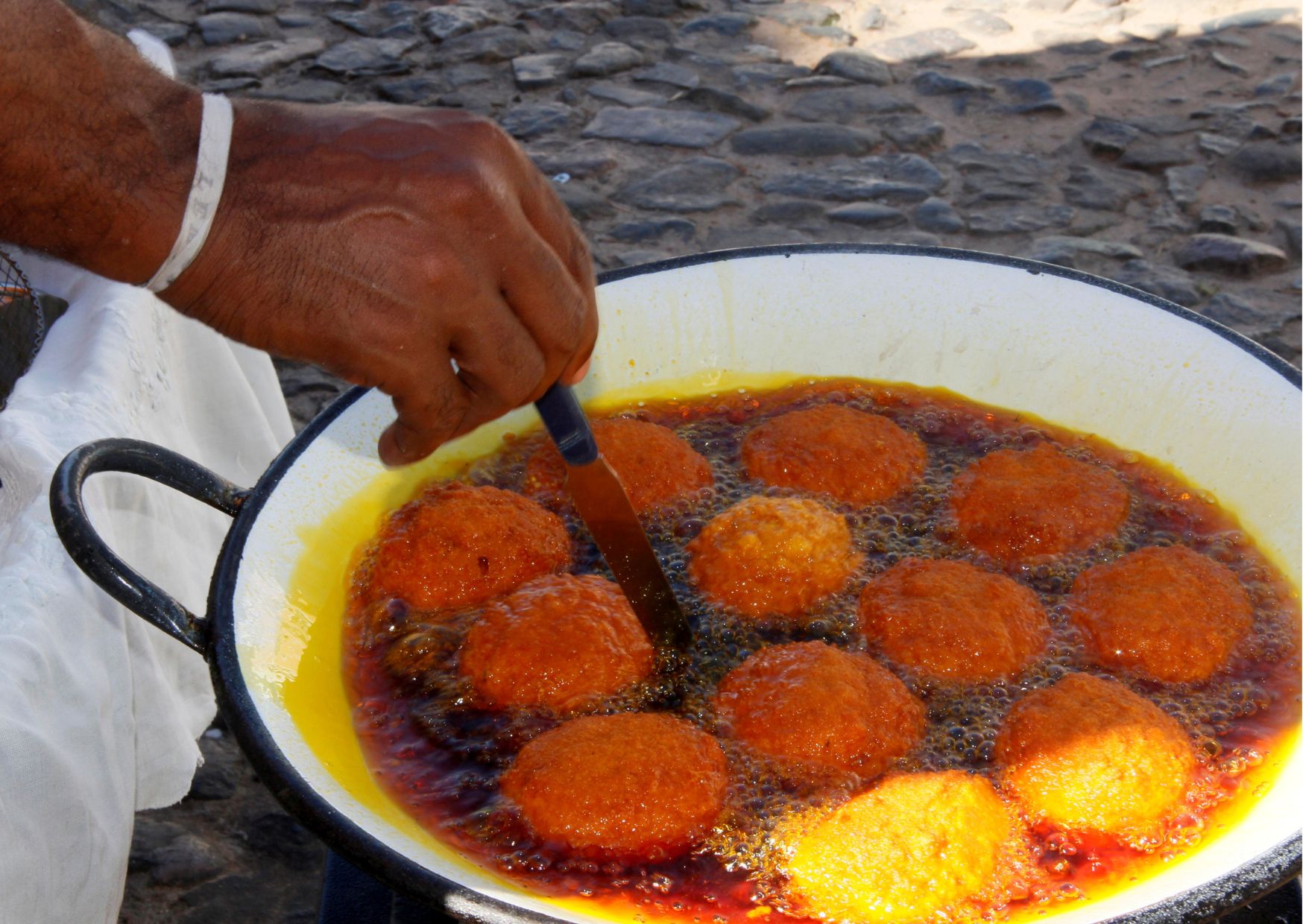 a person holding a bowl of food