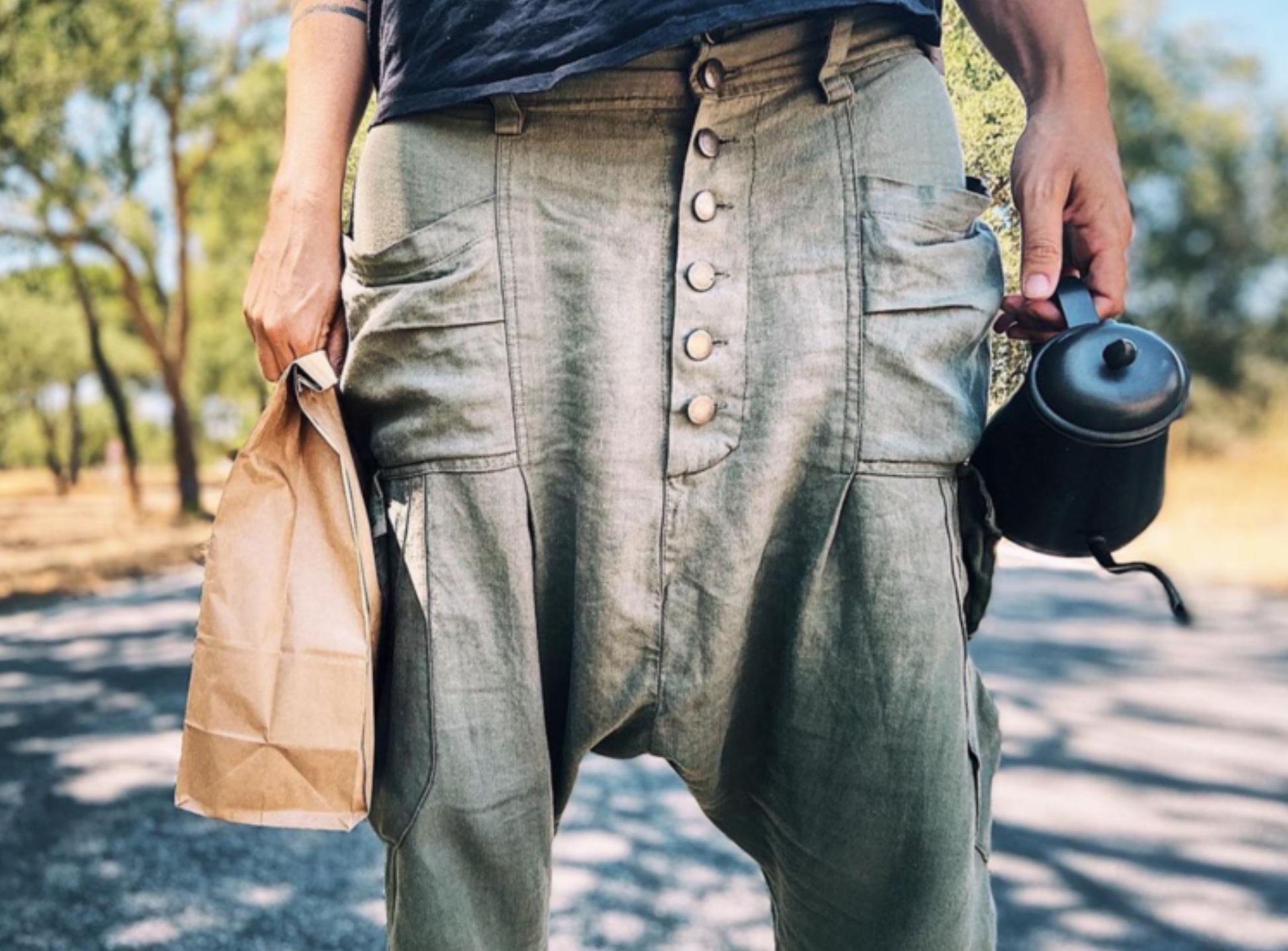 a man standing on a sidewalk