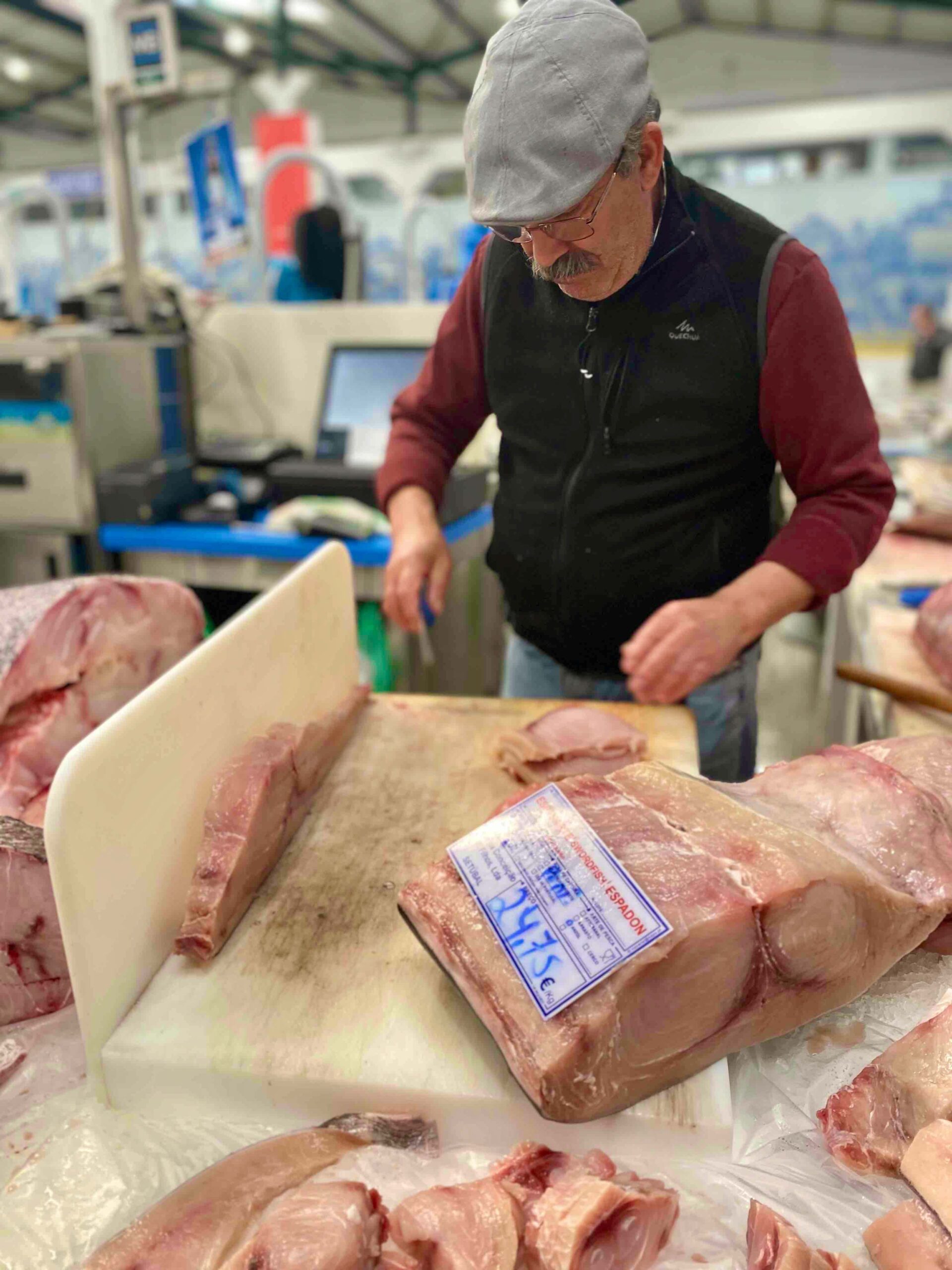 a man holding a box of food