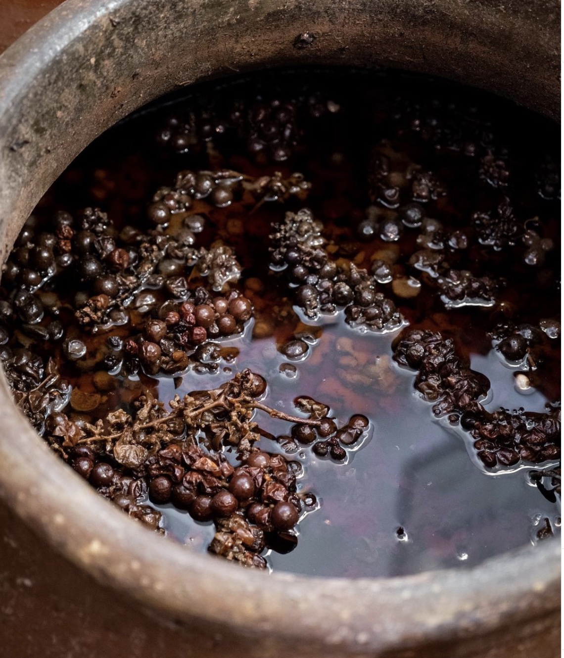 a pot with grapes in it