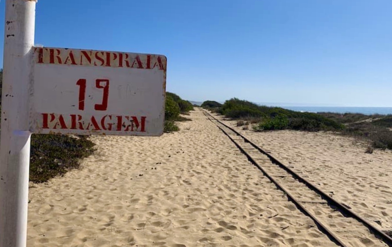 a sign on a beach