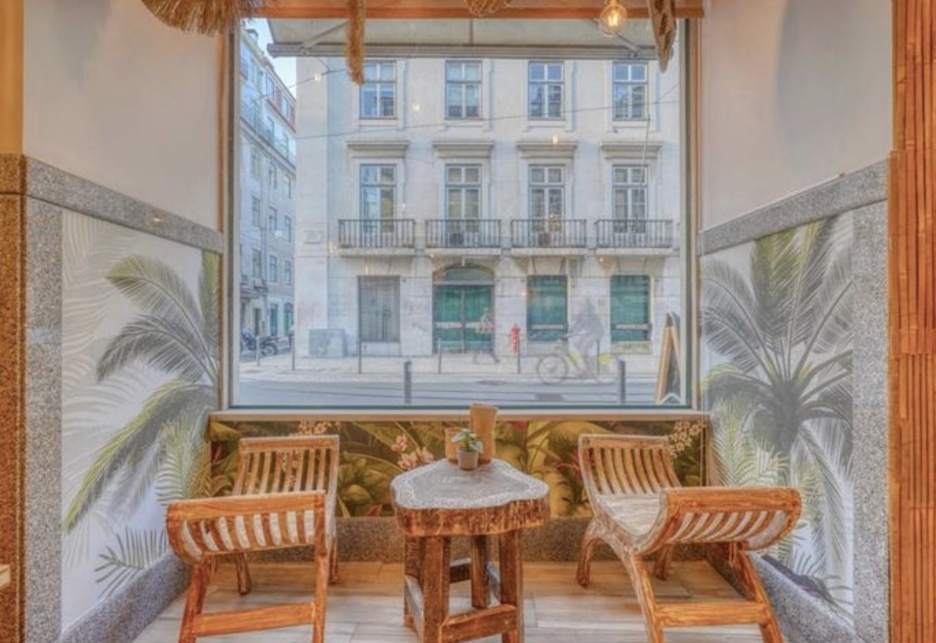 a dining room table in front of a window