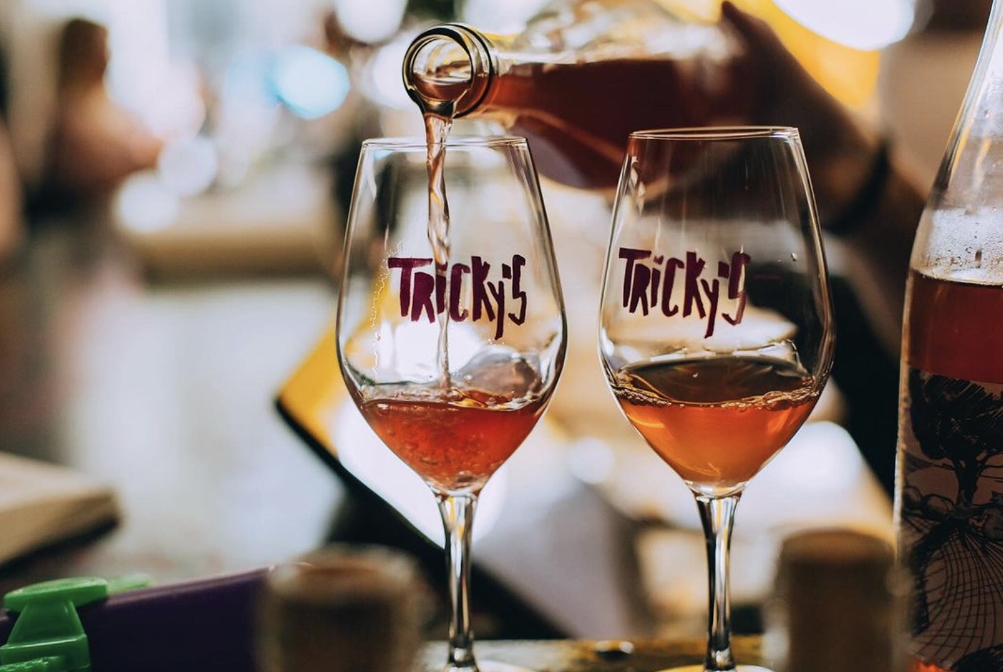 a close up of a bottle and a glass of wine