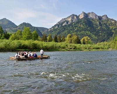 a group of people in a boat on a body of water