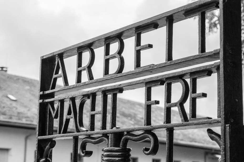 the "Arbeit Macht Frei" sign in a concentration camp