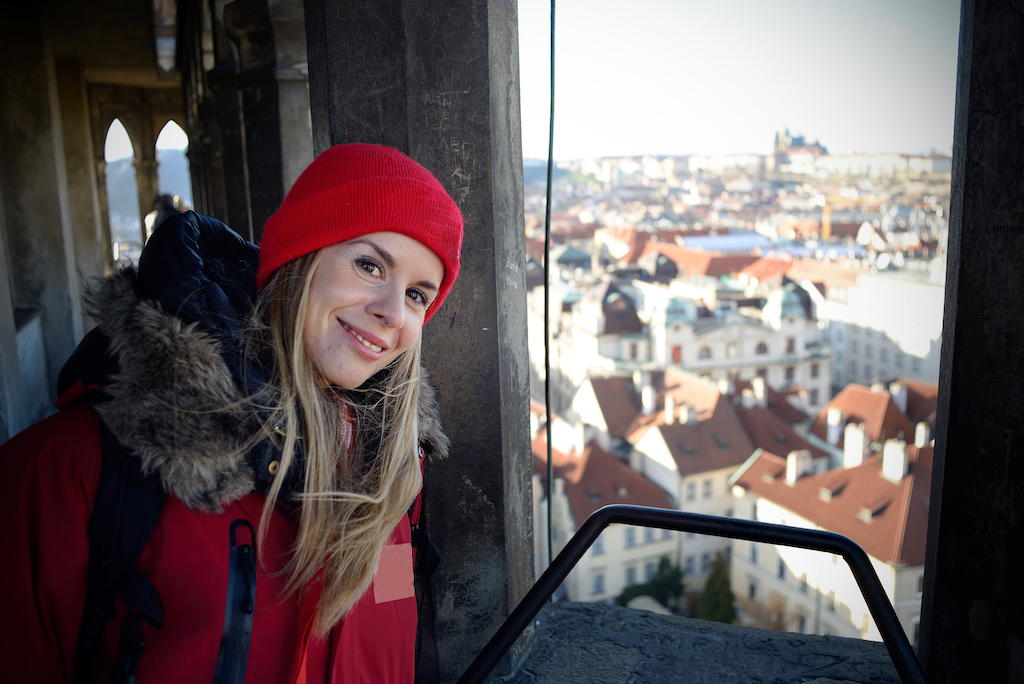 our Prague City guide Tereza enjoying a beautiful view of Prague's rooftops from above