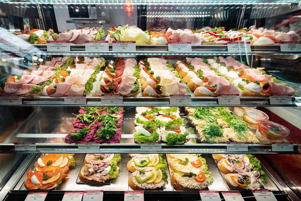 a bunch of different types of traditional Czech open-faced sandwiches on display