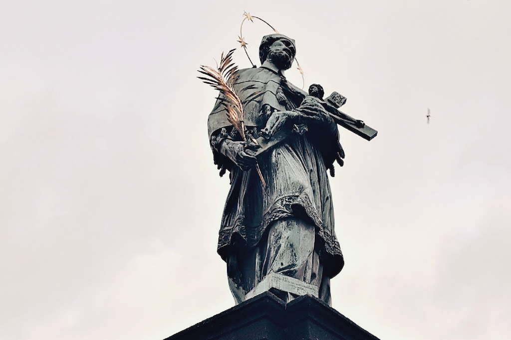 the Statue of John of Nepomuk on the Charles Bridge in Prague