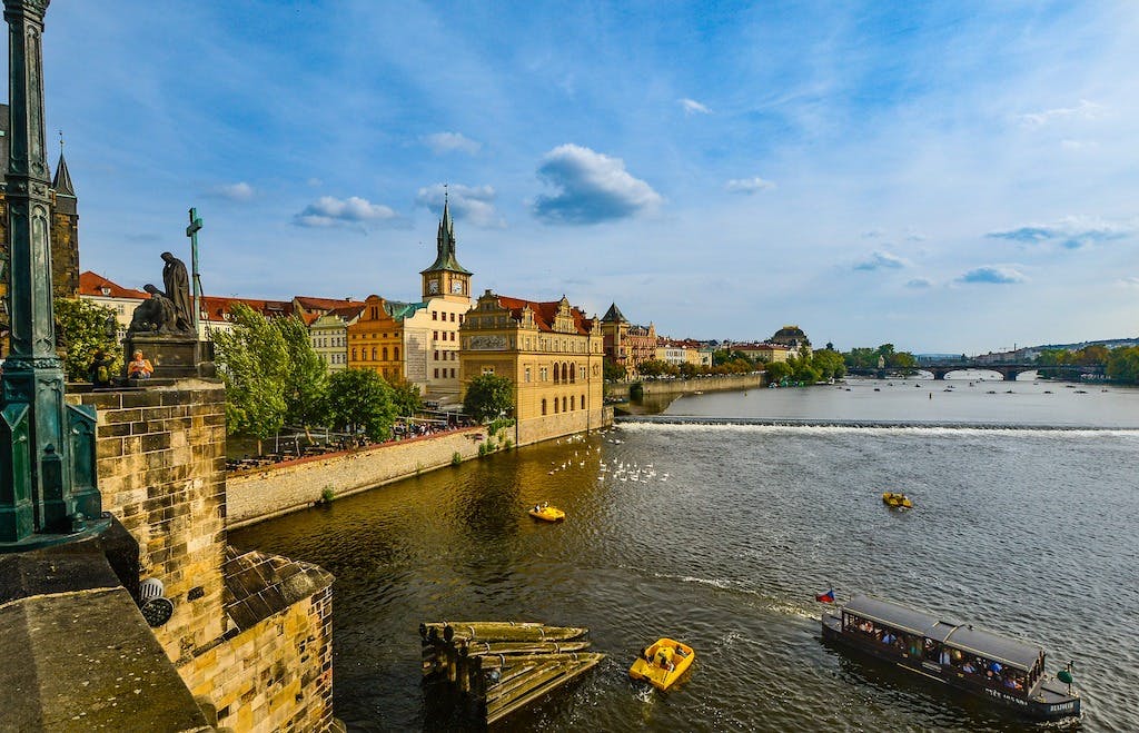 a view of the banks of Vltava River from the Charles Bridge in Prague