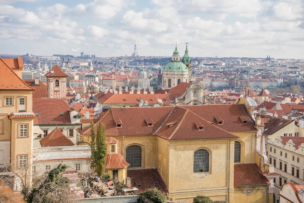a stunning view of the Lesser Town of Prague and the St. Nicolas Church