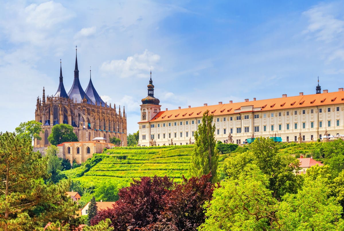 a scenic view of Kutna Hora with St Barbara's Cathedral on the left
