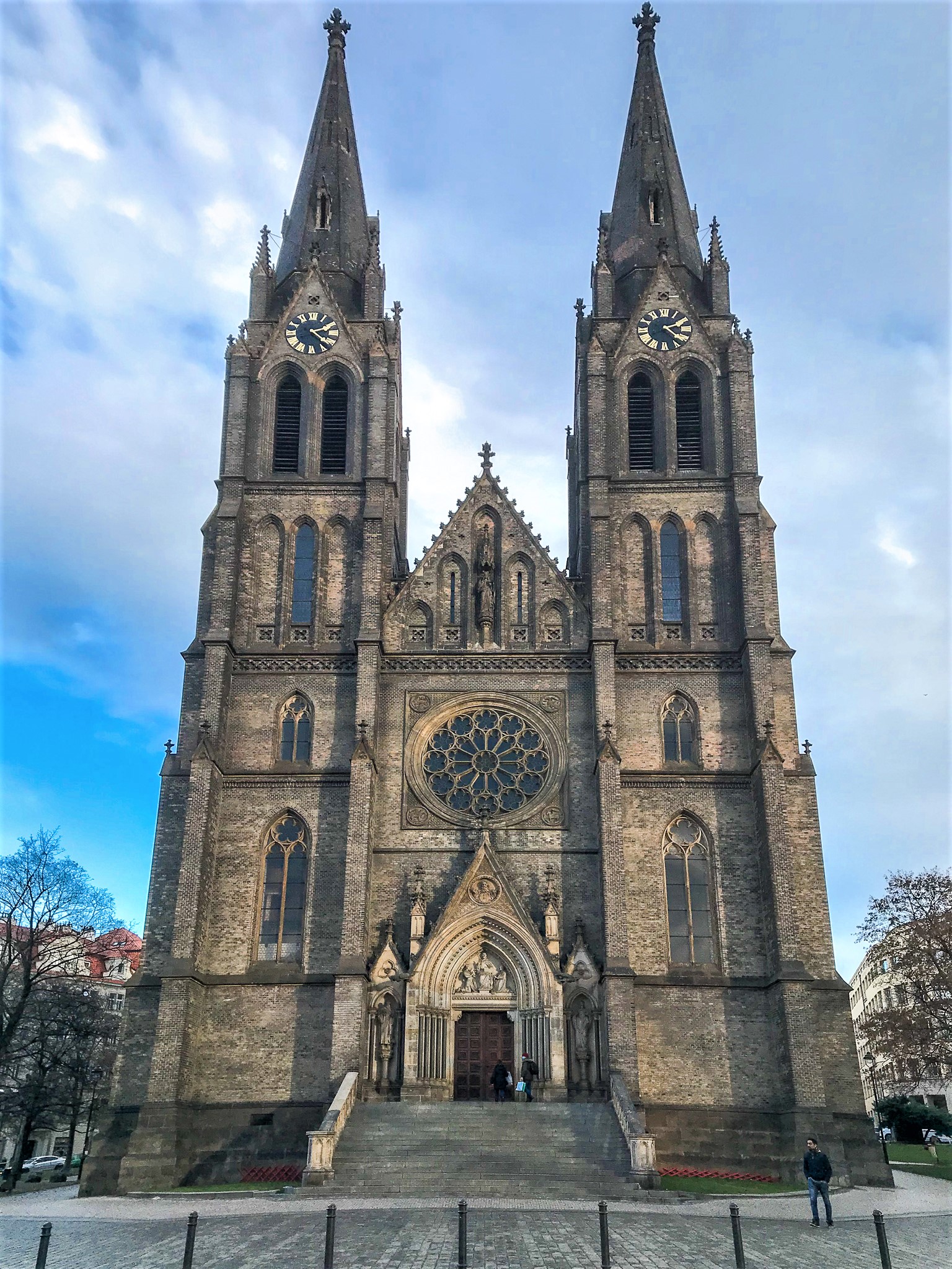 a large stone building with a clock on the front of a church