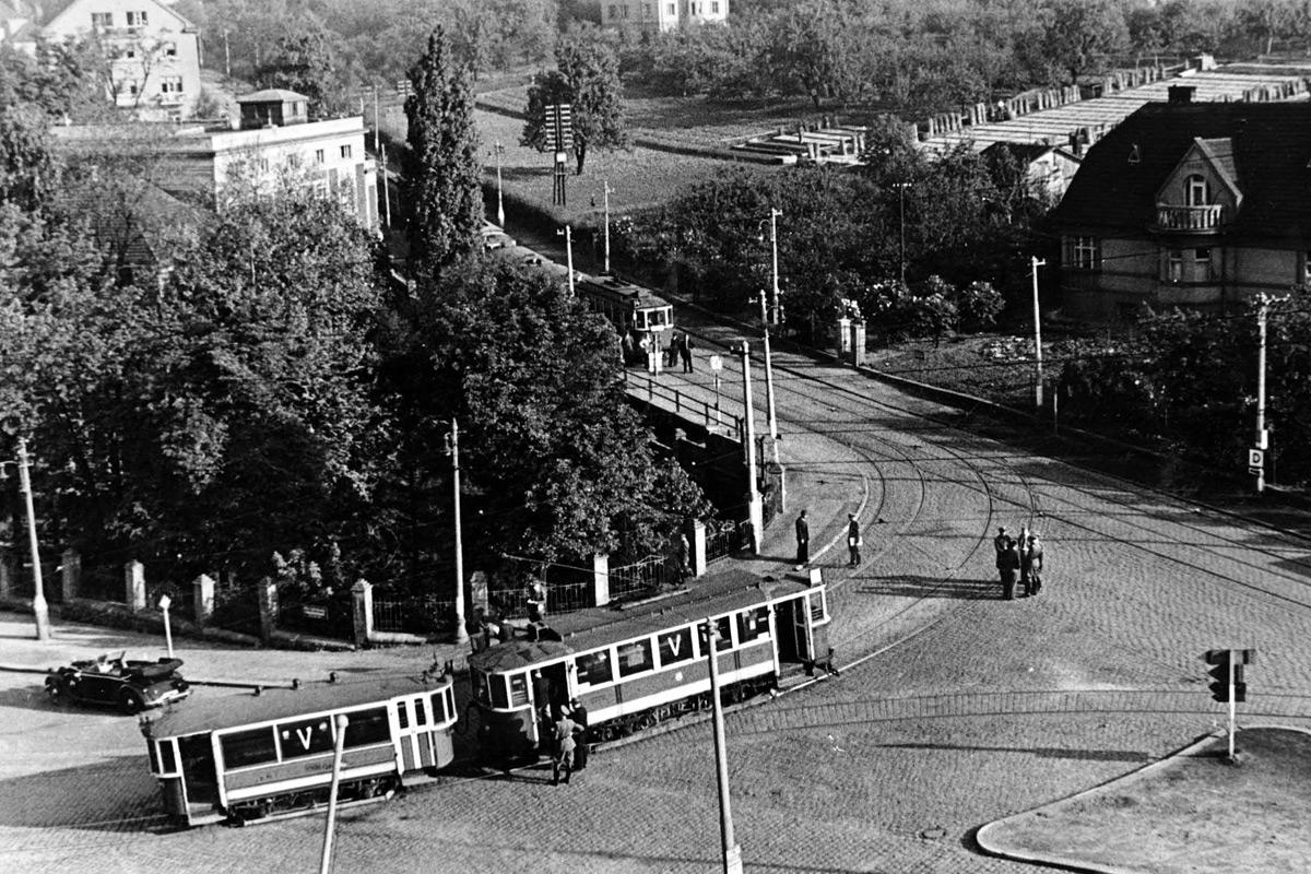 a group of people sitting at a bus stop