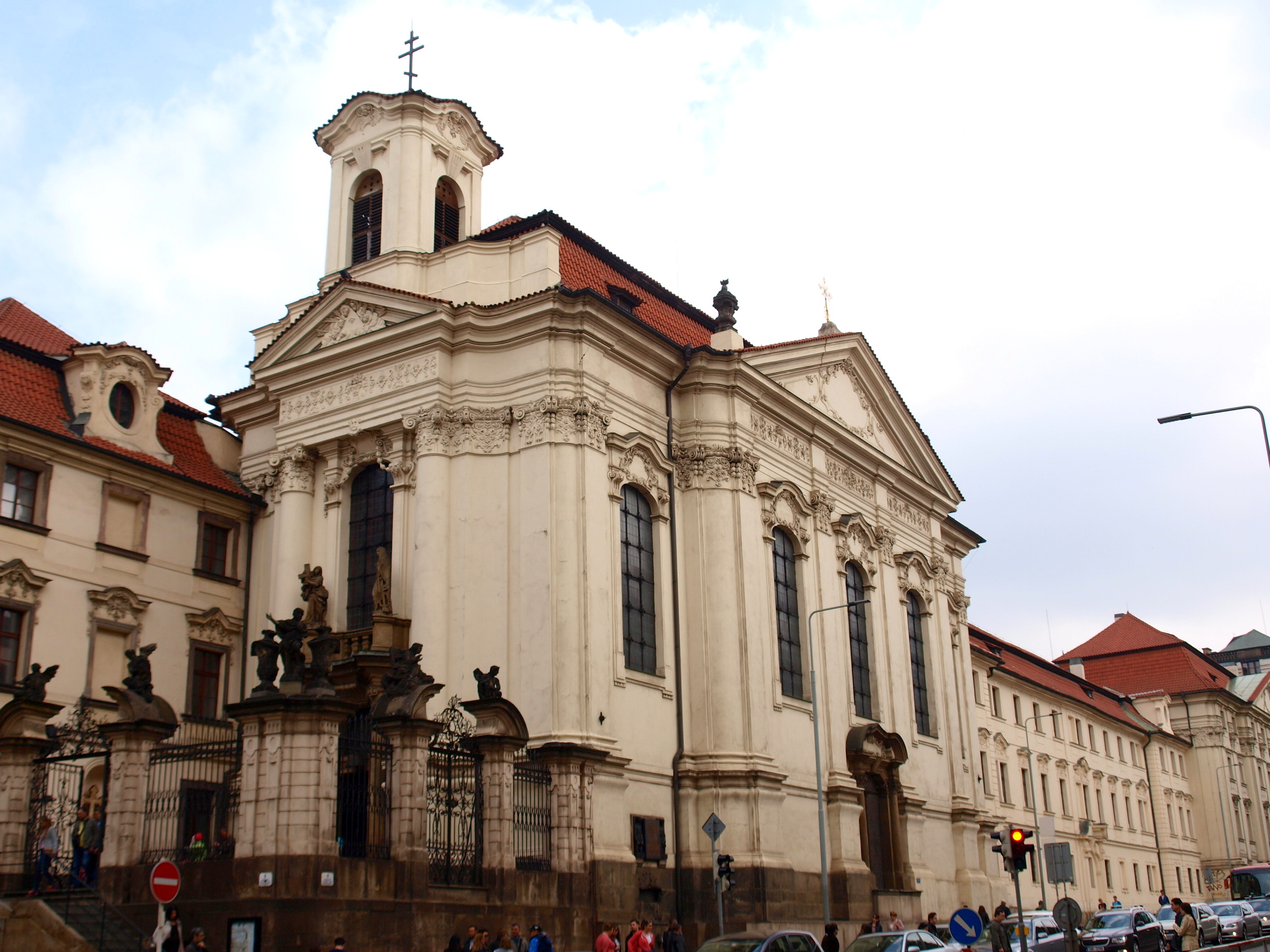 a group of people walking in front of a building