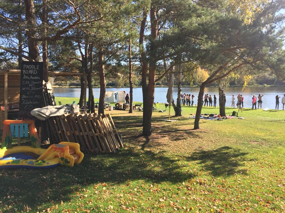 a group of people sitting on a bench in a park