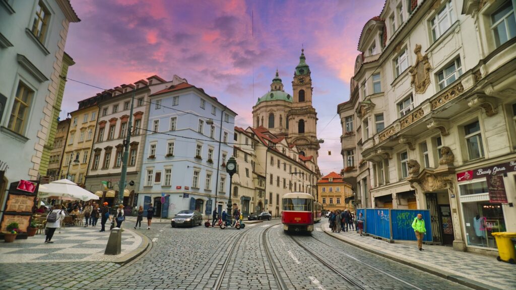 the streets of the Lesser Town in Prague, with St. Nicolas Church in the background