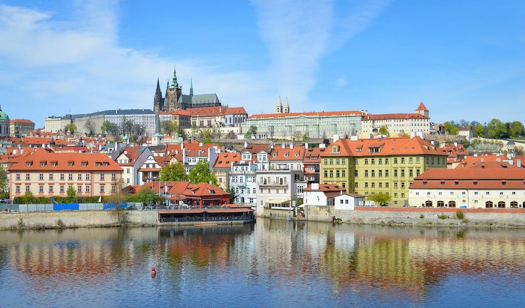a scenic view of Prague Castle and the Lesser Town from the Vltava River