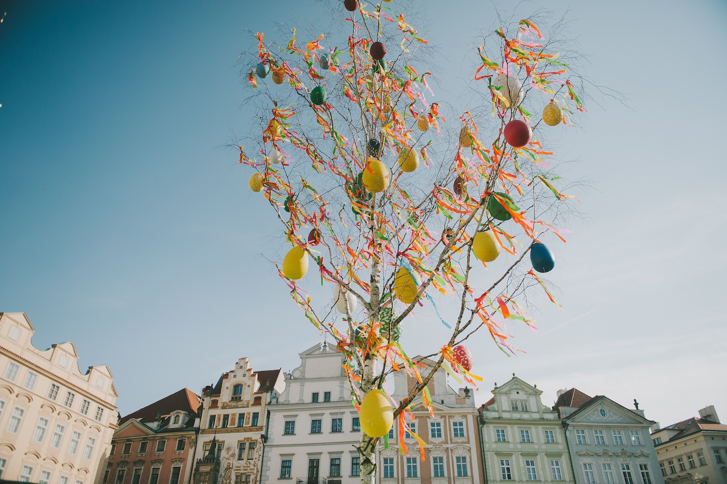 a group of people flying kites in a building