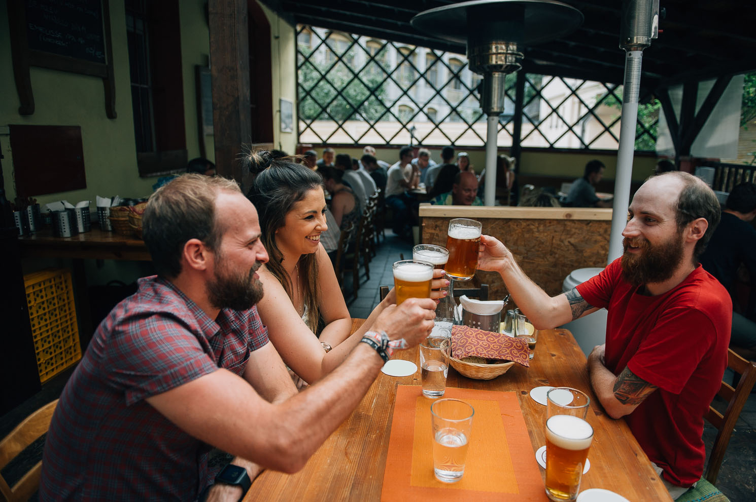 a group of people sitting at a table in a restaurant