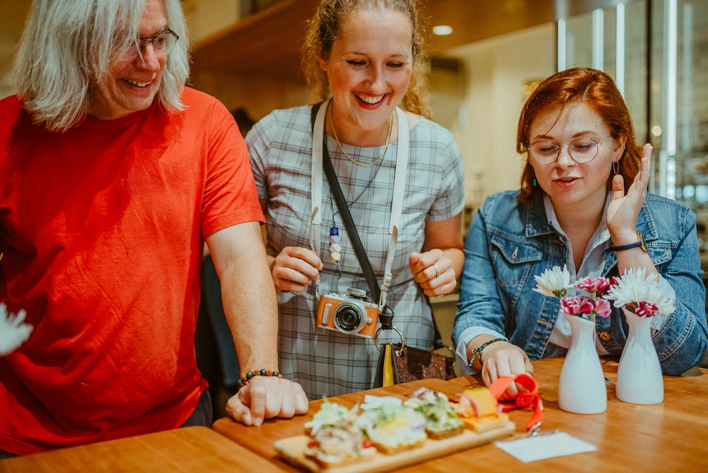 tourists enjoying bites of traditional Czech cuisine on a food tour in Prague