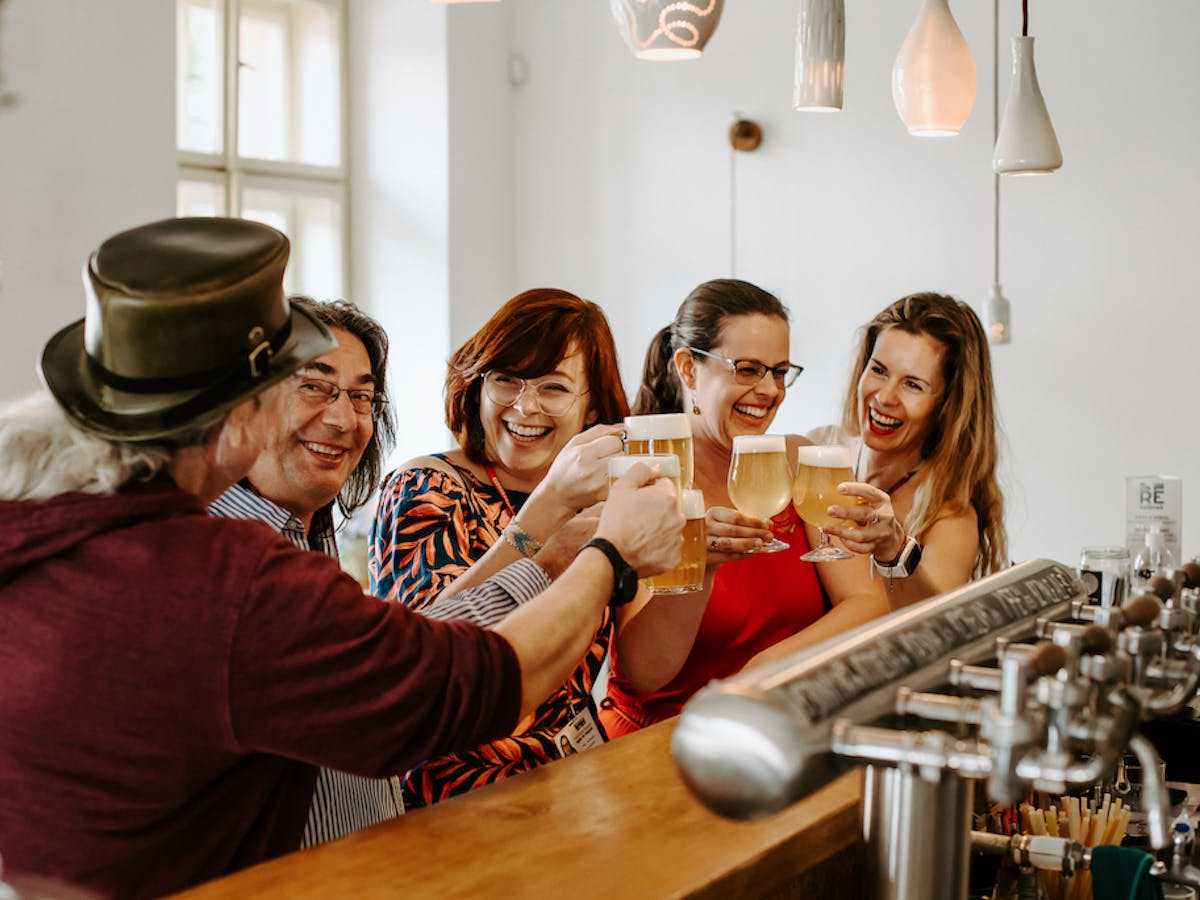 tourists having fun sampling beer from Prague microbreweries on a Beer Tour in Prague