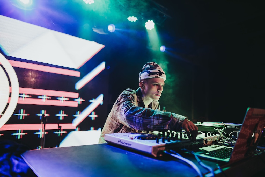 a DJ playing music in a night club in Prague
