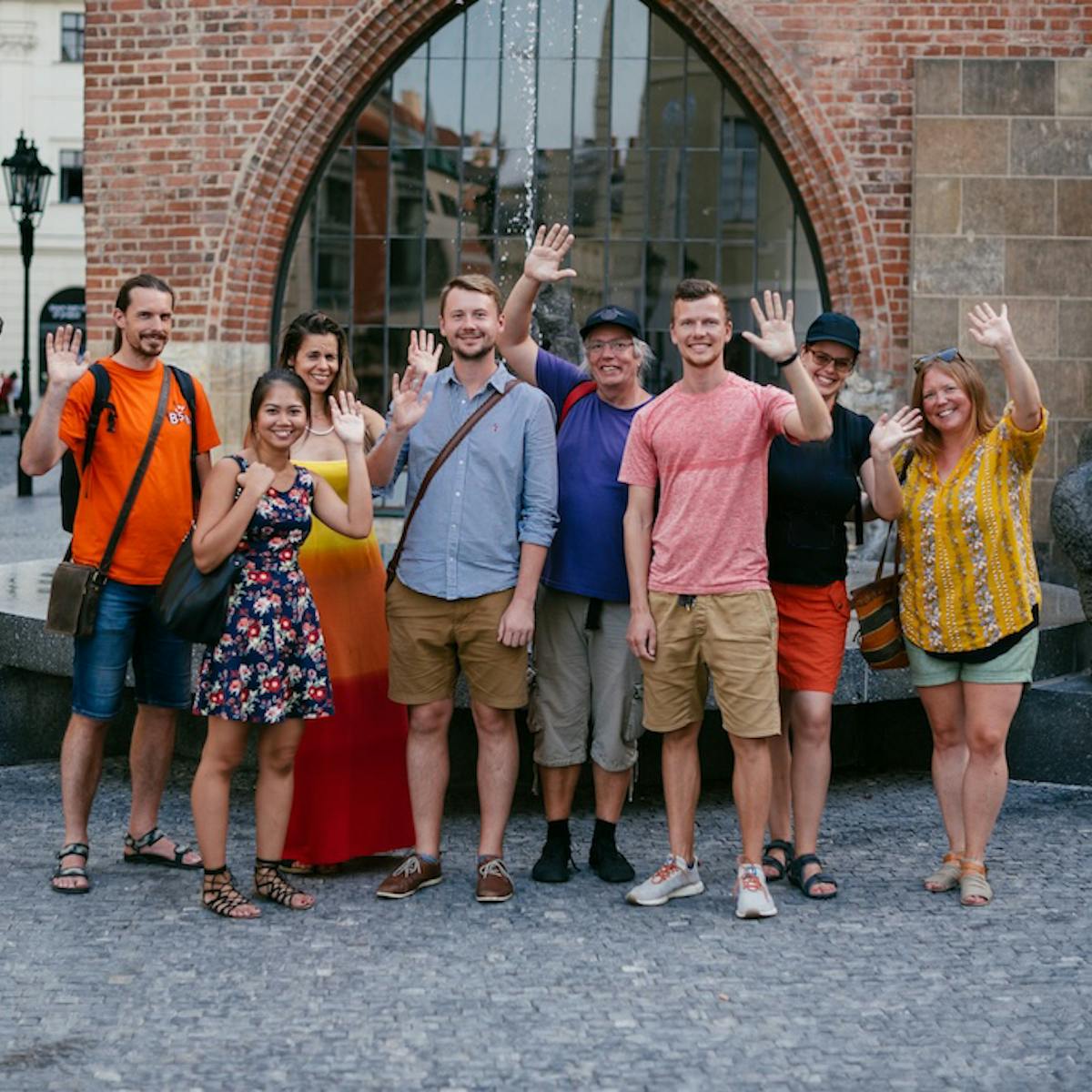 Prague City Adventures team standing together and waiving at the camera
