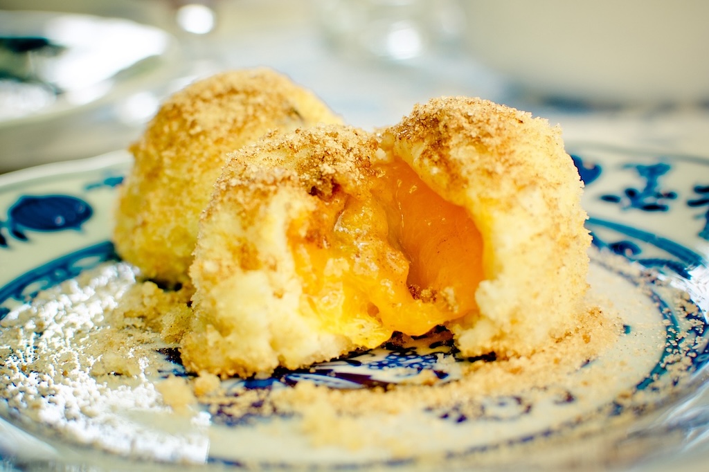 a plate of traditional Czech fruit dumplings filled with apricots