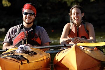 a couple in touring kayaks