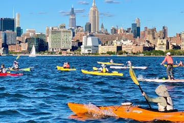 people kayaking and paddle boarding in NYC
