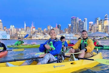 people kayaking in the evening in NYC