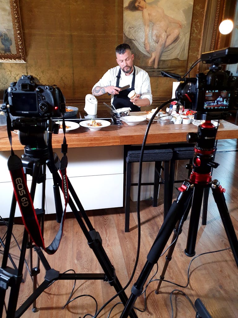A chef cooking in front of a camera