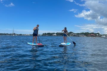 Cute couple having fun on a paddleboard rental from Paddles Outdoor Rentals in Crystal River, Florida