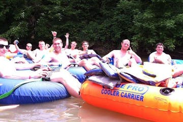a group of people sitting on a raft