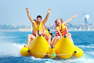 two people riding on a banana boat