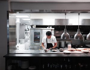 a man cooking in a kitchen