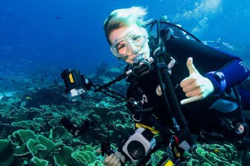 A scuba diver taking underwater photos