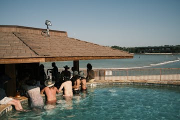 people drinking at a pool bar