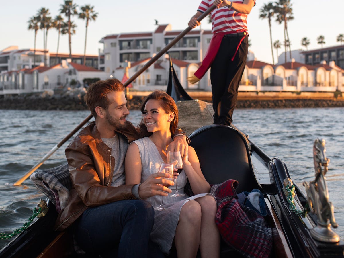 A couple celebrating Valentine's Day at The Gondola Company on a gondola ride in San Diego
