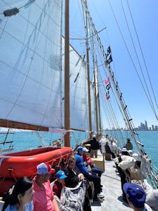 Guests aboard Tall Ship Windy sailing on Lake Michigan