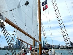 View from the decks of Tall Ship Windy with full sails and the Chicago Skyline in the distance