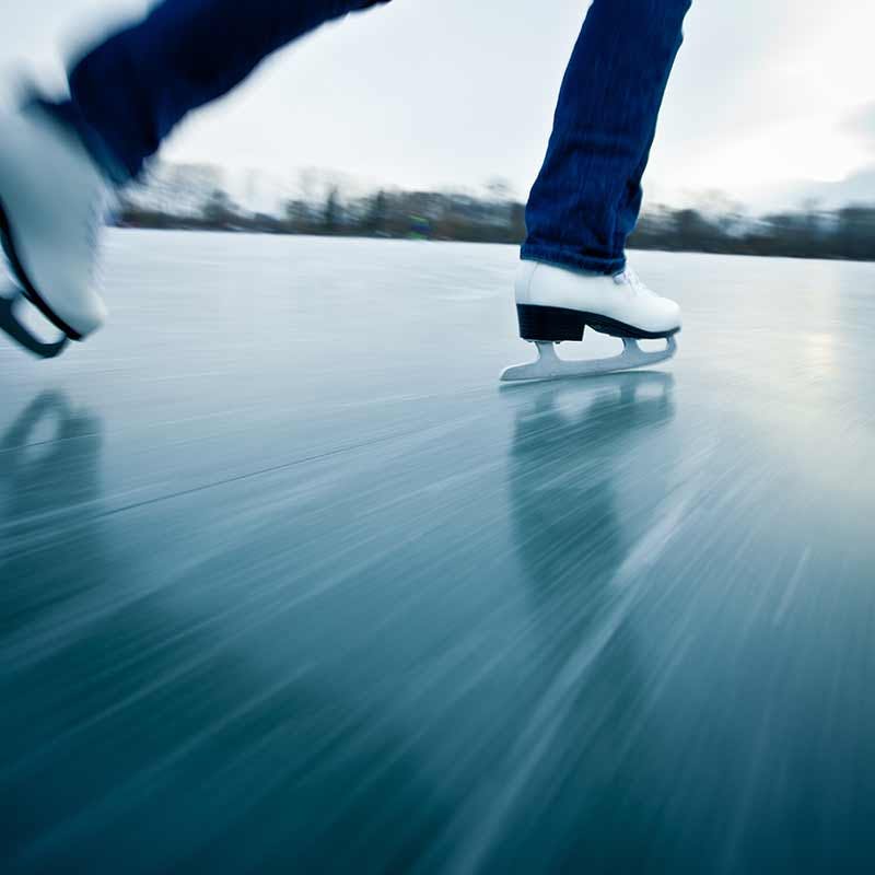 A person ice skating outdoors