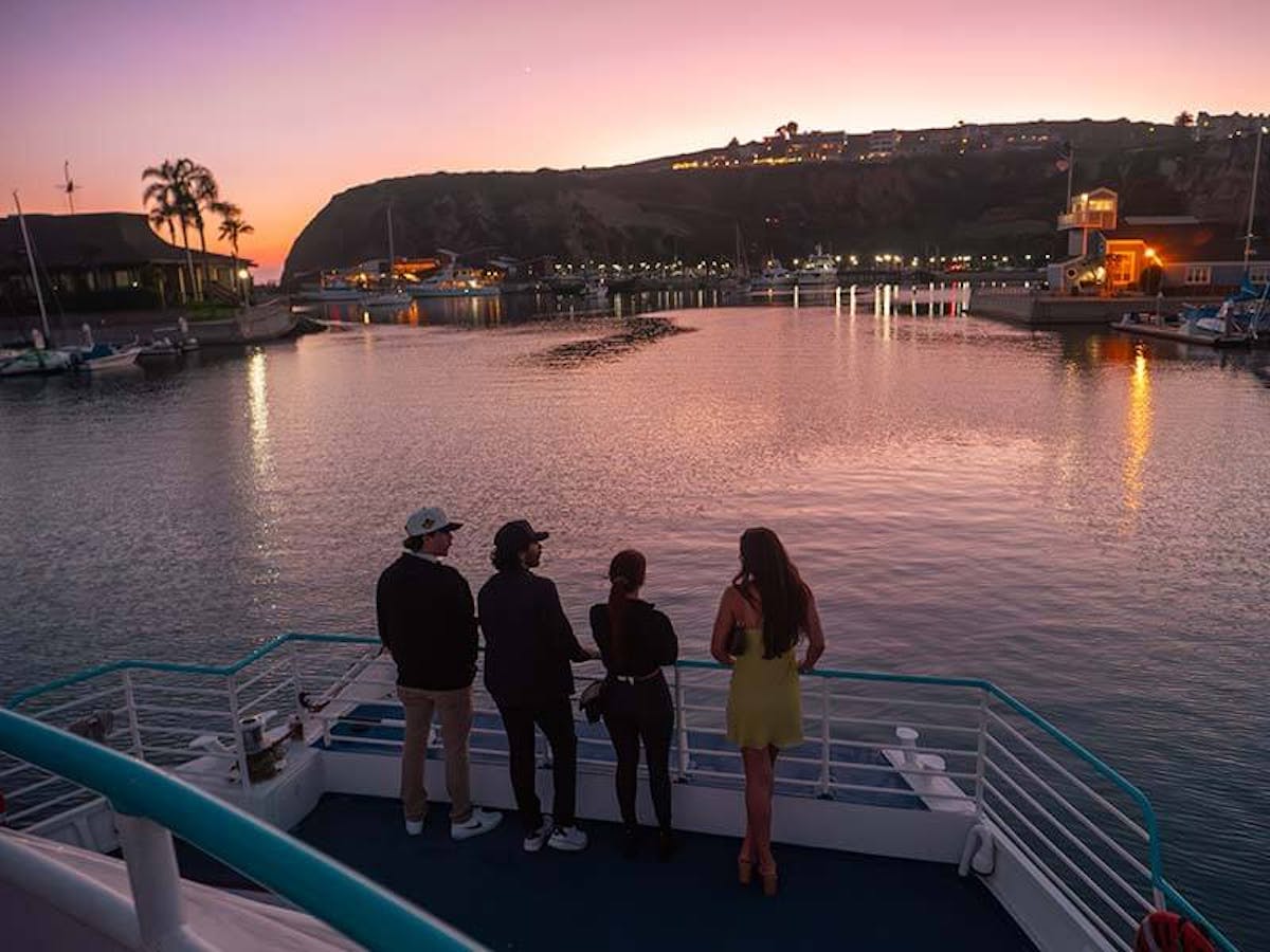 Guests enjoy the sunset during Brews Cruise beer tasting experience in Dana Point