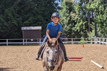 Amy Nobleza riding a horse