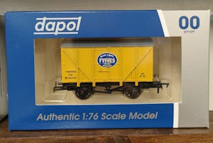 close up of yellow model railway box van