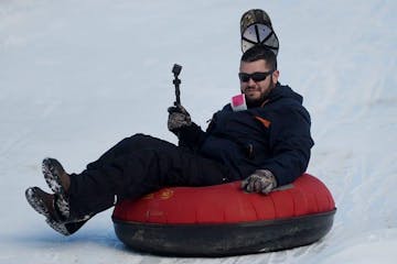 a man holding a snow board
